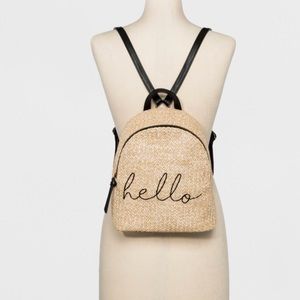 T-shirt and jeans straw backpack